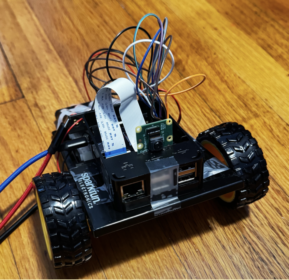 BotBuddy V0 rover — Raspberry Pi, motor driver, camera, wiring visible